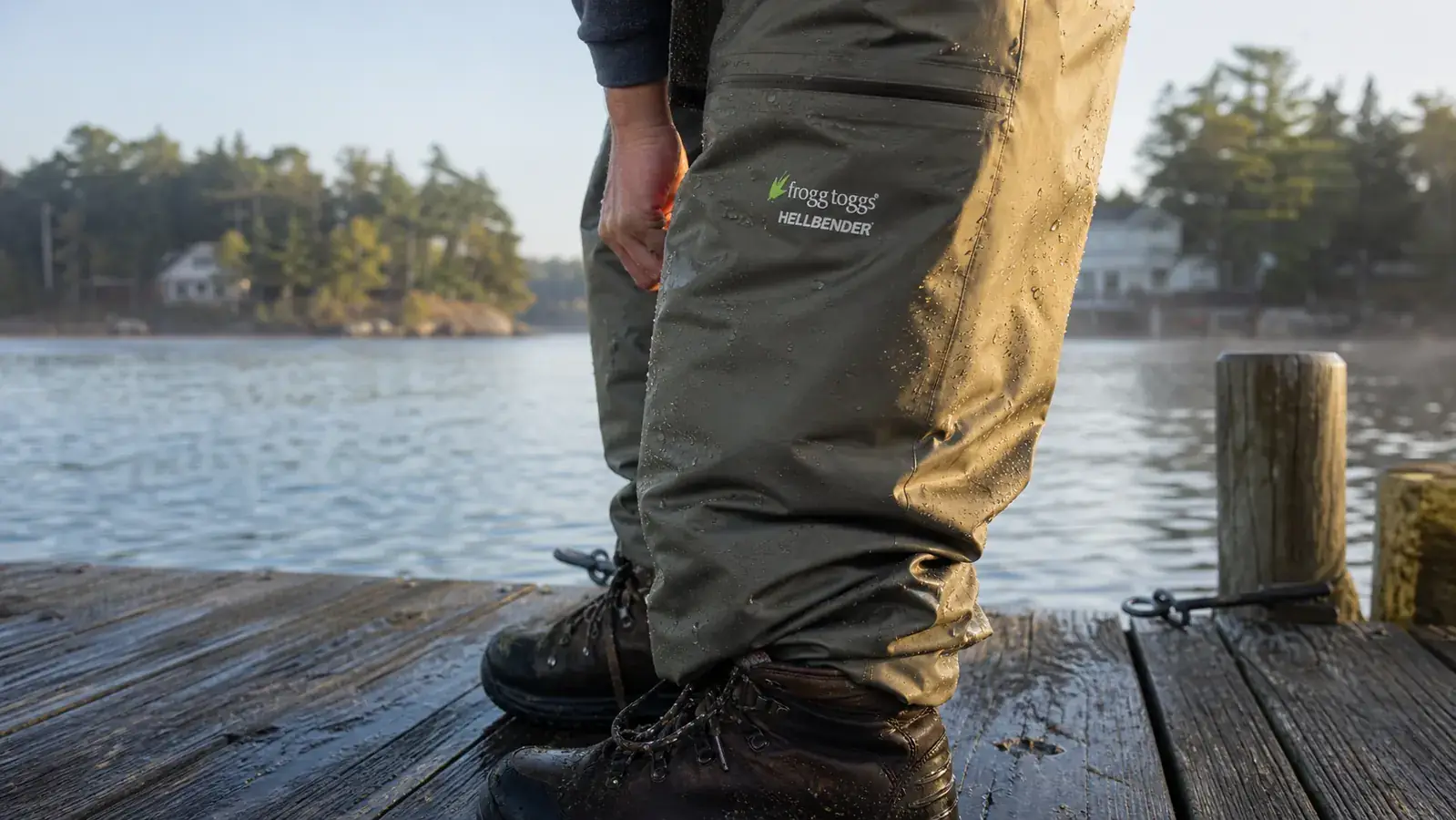 Frogg Toggs Hellbender breathable chest waders laid out with the stockingfoot tucked into a wading boot on a dock