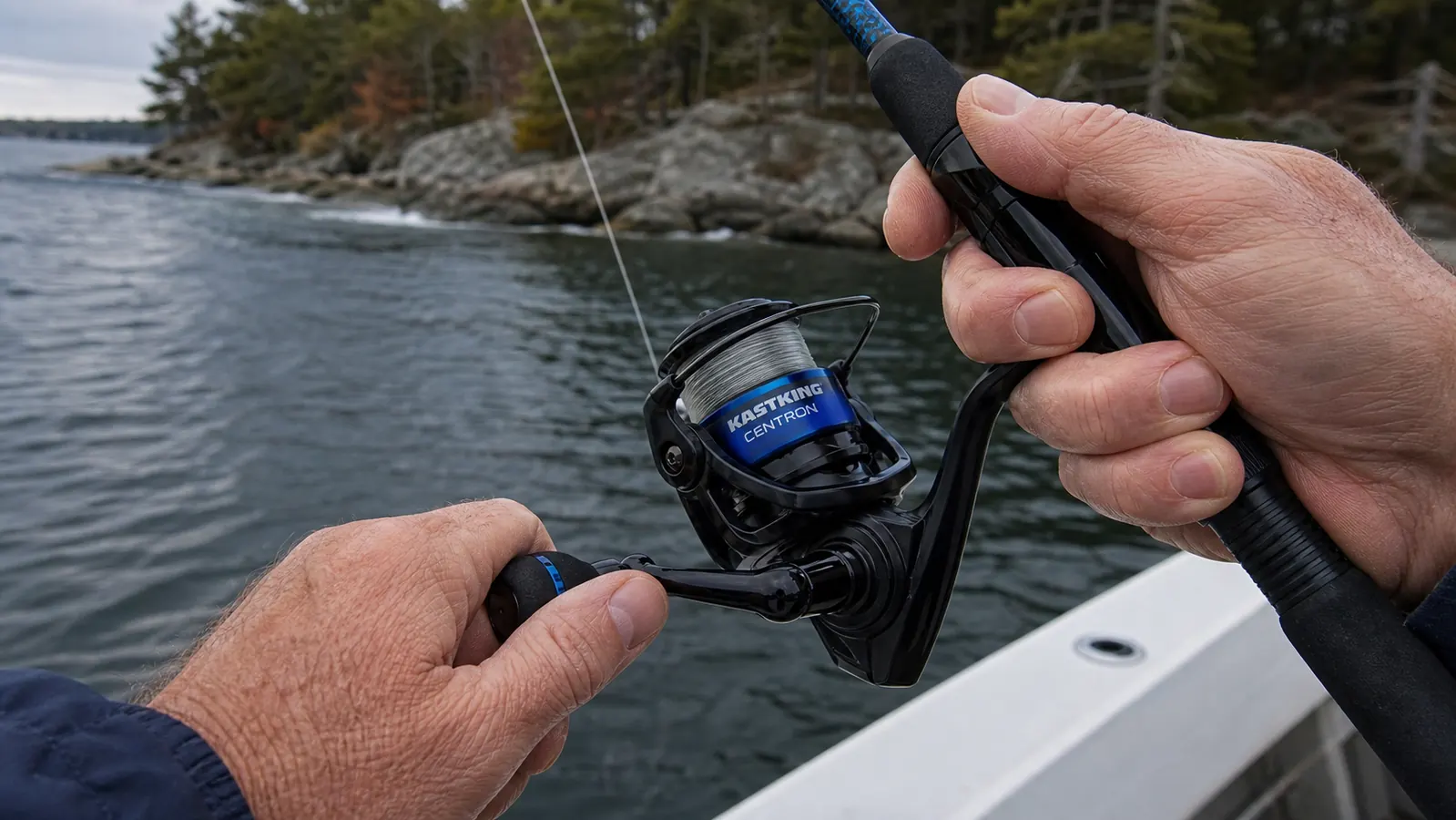 A hand palming the spool of a KastKing Centron spinning reel while a fish surges near the boat